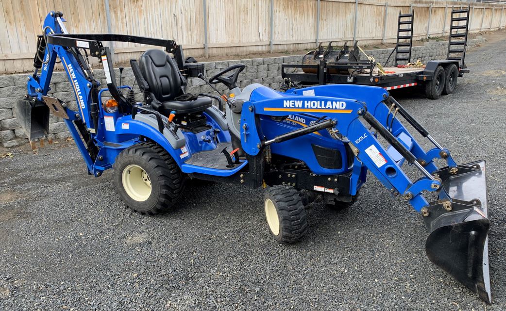 New Holland Tractor with front loader and backhoe